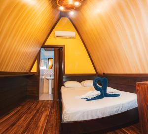 Ένα ή περισσότερα κρεβάτια σε δωμάτιο στο Termales del Arenal