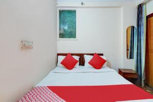 Ένα ή περισσότερα κρεβάτια σε δωμάτιο στο Hotel O Ratiram +24 φωτογραφίες