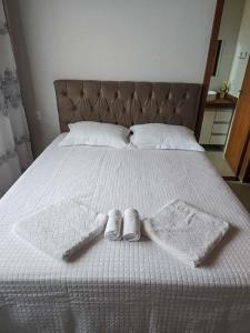 Ένα ή περισσότερα κρεβάτια σε δωμάτιο στο Casa temporada Bela Vista