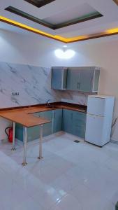 Kuchyň nebo kuchyňský kout v ubytování منتجع سيتي لاند