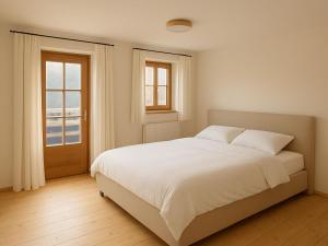 Ένα ή περισσότερα κρεβάτια σε δωμάτιο στο Tirola Hütte