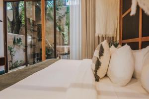 Postel nebo postele na pokoji v ubytování CIGNO Mejorada