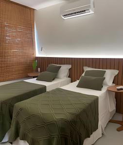 Postel nebo postele na pokoji v ubytování Tulum House Milagres