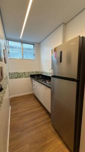 Η κουζίνα ή μικρή κουζίνα στο Apt 711 - Elegância com vista parcial do mar