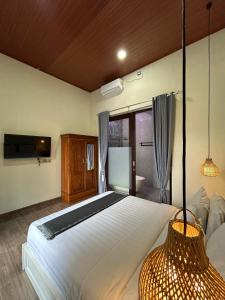 Ένα ή περισσότερα κρεβάτια σε δωμάτιο στο Rara Biru Modern 2BR Villa with Private Pool