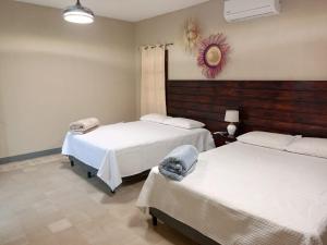 Ένα ή περισσότερα κρεβάτια σε δωμάτιο στο Casa Villa Klala