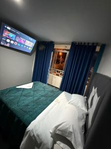 Postel nebo postele na pokoji v ubytování Hotel El Arizal Paracas