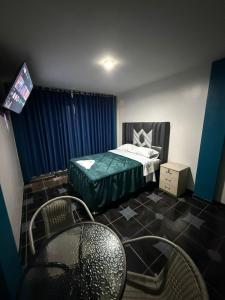 Postel nebo postele na pokoji v ubytování Hotel El Arizal Paracas