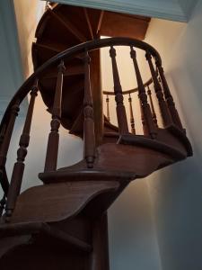 a close up of a wooden spiral staircase at Florian's Hostel in Rio de Janeiro