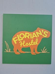 a sign for a floreants hospital with a dog at Florian's Hostel in Rio de Janeiro