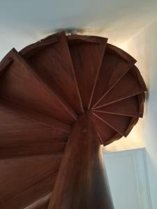 a close up of a wooden bed with a window at Florian's Hostel in Rio de Janeiro +26 photos