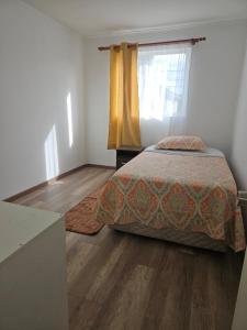 Postel nebo postele na pokoji v ubytování Acogedora casa centrica en Valdivia para 4 personas