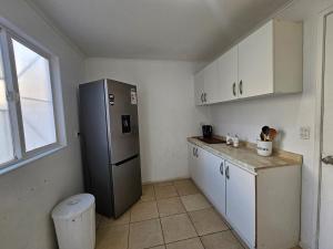 Kuchyň nebo kuchyňský kout v ubytování Acogedora casa centrica en Valdivia para 4 personas