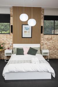 Ένα ή περισσότερα κρεβάτια σε δωμάτιο στο Mirambeena Retreat