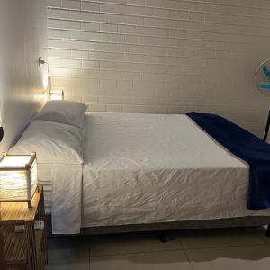 En eller flere senge i et værelse på Pousada Encantos do Rosa