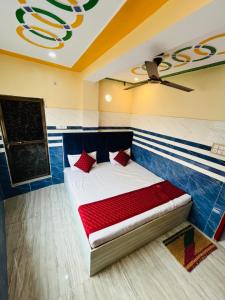 a bed in a room with a ceiling at Kashi Inn RESIDENCY in Varanasi