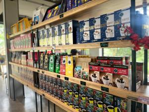 a store shelf filled with different types of dog food at Mountain Hill in Mai Sơn