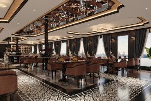 een eetkamer met tafels en stoelen en ramen bij AIME'E CRUISES - Halong Bay in Ha Long