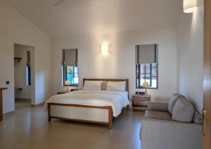 Ένα ή περισσότερα κρεβάτια σε δωμάτιο στο Beach front villa Ashwem Ocean