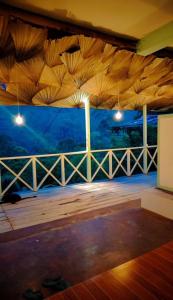 a room with a view of a wooden deck at Zen Garden Palace in Ella +2 photos