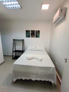 Ένα ή περισσότερα κρεβάτια σε δωμάτιο στο Essenza Suites Natal