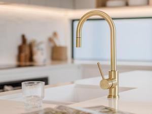 a kitchen sink with a faucet and a glass at Kai Residences in Cabarita Beach +61 photos