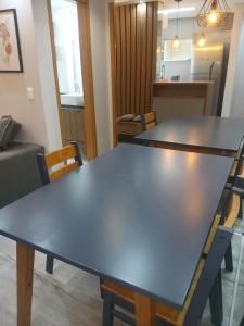 a conference room with a large table and chairs at Belíssimo apartamento in Sao Paulo +5 photos