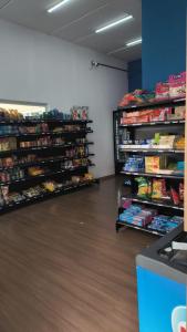 a store with shelves filled with different types of food at Belíssimo apartamento in Sao Paulo
