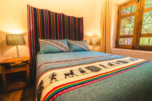 Postel nebo postele na pokoji v ubytování Ckoi Atacama Lodge