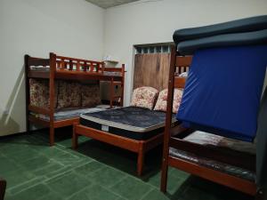 Ένα ή περισσότερα κρεβάτια σε δωμάτιο στο Caza di Maria a beira rio