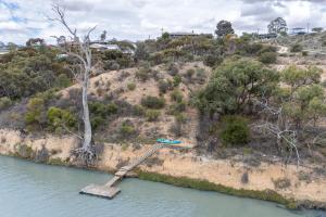 an island in the middle of a body of water at River Murray Views in Nildottie
