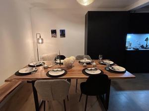 a cat sitting on top of a wooden table at Nouveau ! Appartement de standing 3 chambres avec balcon et parking couvert - FR-1-836-42 in Les Carroz d'Araches