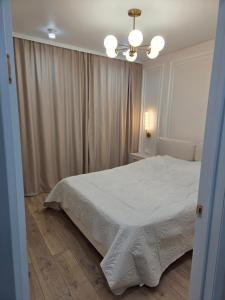 Ένα ή περισσότερα κρεβάτια σε δωμάτιο στο Liberty