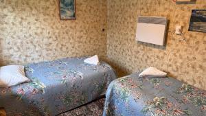 Ένα ή περισσότερα κρεβάτια σε δωμάτιο στο Mountains Edge Cabins