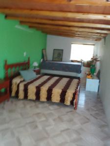 En eller flere senge i et værelse på Casa lo de norma + 2 billeder