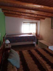 En eller flere senge i et værelse på Casa lo de norma