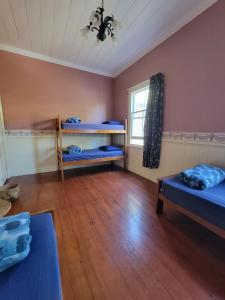 Postel nebo postele na pokoji v ubytování Endless Summer Lodge - Guesthouse