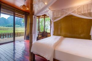 Voodi või voodid majutusasutuse Lotus Field Homestay toas +99 fotot