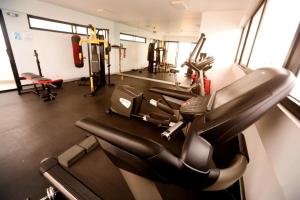a gym with several treadmills and cardio machines at Perfect Balance Rest and Work Study Oceanfront in San Antonio
