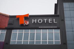 a hotel sign on the side of a building at T Hotel Jalan Sultanah in Alor Setar