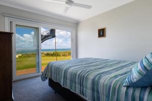 Postel nebo postele na pokoji v ubytování Beachcombers Rest - Tokerau Beach Escape