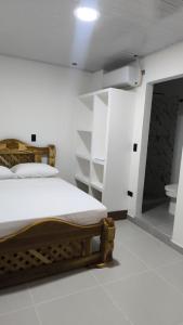 Ένα ή περισσότερα κρεβάτια σε δωμάτιο στο Hotel coral Issa