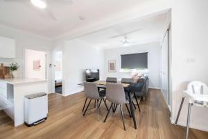 a dining room and living room with a table and chairs at Tamworth Loft - Cosy & Convenient, Ideal for Work in Dubbo +11 photos