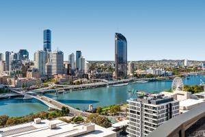 a view of a city with a river and buildings at River-View Unit with Rooftop Pool near Museums in Brisbane