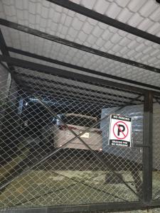 a cage with a no parking sign on it at Casa Boutique Hotel in Salento
