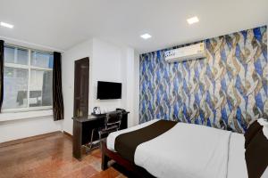 Ένα ή περισσότερα κρεβάτια σε δωμάτιο στο Super Townhouse Oak Q-City Techno Park