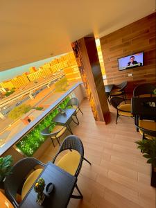 Μια τηλεόραση ή/και κέντρο ψυχαγωγίας στο Pyramids Guest House View Hotel