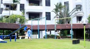 a group of children playing on a playground at Danau Toba Hotel International in Medan