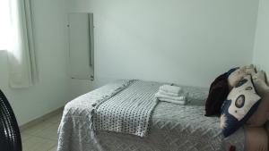 a bedroom with a bed in a room at Recanto da Chapada in Alto Paraíso de Goiás