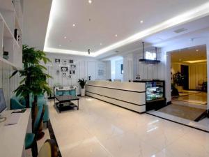 a large room with a lobby with a reception desk at Xana Lite· Xi'an South Gate Yongningmen Subway Station in Xi'an